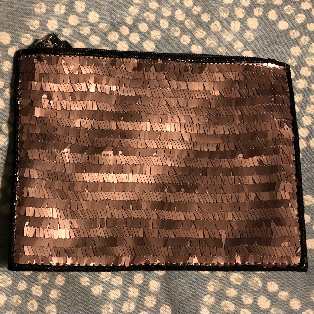 Brand new. Never used. Copper sequin pouch